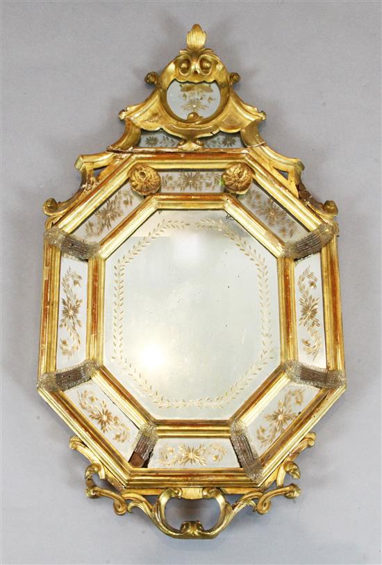 A late 19th century Venetian giltwood wall mirror, W.1ft 11in. H.3ft 3in.